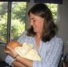 Dr. Jennifer Eames holding three-day-old Riley Clark