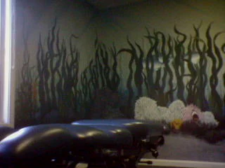 The Fish Room, an adjusting room with an underwater mural