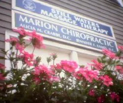 Marion Chiropractic sign with pink flowers out front