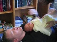 A newborn receiving a gentle chiropractic adjustment