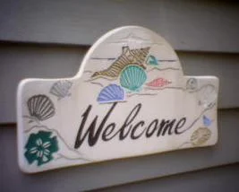 Seashell Welcome sign on the office wall